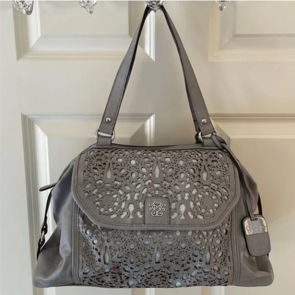 Beautiful gray handbag with unique cutout design by Jessica Simpson.